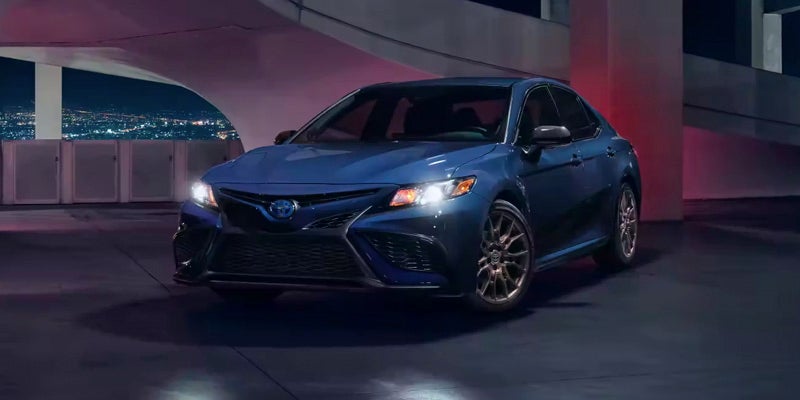 A 2024 Toyota Camry Hybrid parked at night near Pleasant Hills, PA