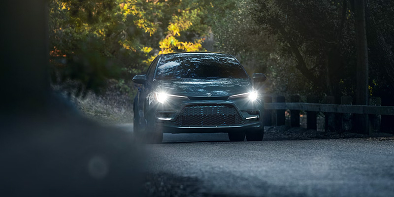 A 2025 Toyota Corolla lighting up a dark street in Pleasant Hills, PA 