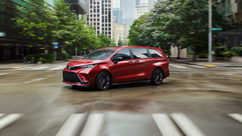 2025 Toyota Sienna taking a turn on the a road