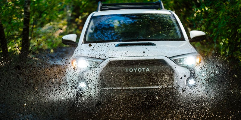 A 2024 Toyota 4Runner driving through mud in Pleasant Hills, PA