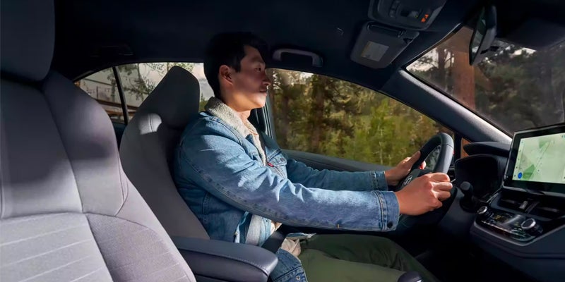 A driver behind the wheel of a 2024 Toyota Corolla in Pleasant Hills, PA