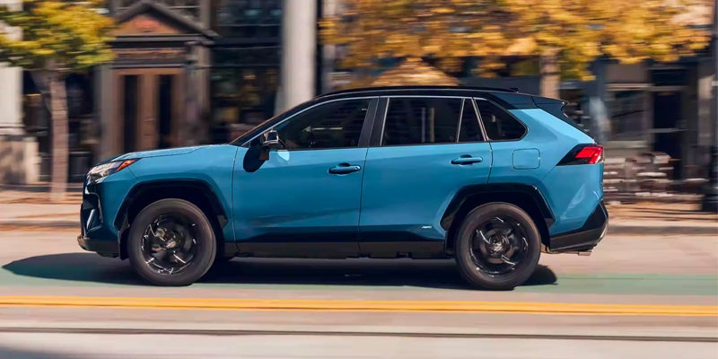A 2024 Toyota RAV4 Hybrid speeding down the road in Pleasant Hills, PA