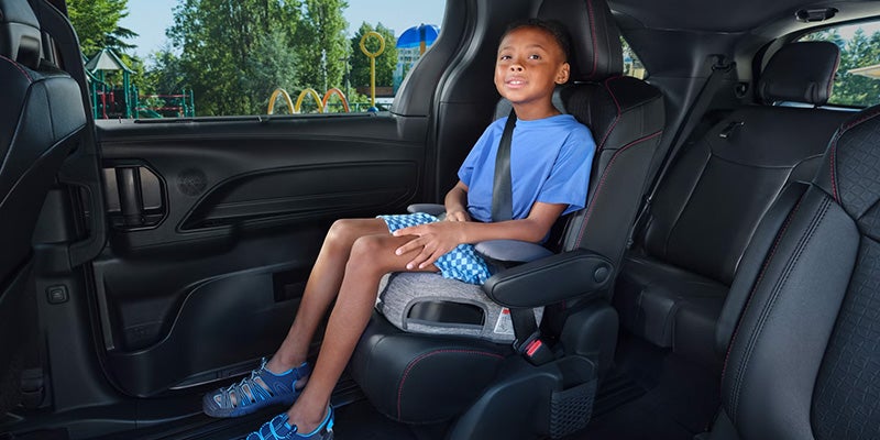 A kid sitting in the back of the 2025 Toyota Sienna in Pleasant Hills, PA